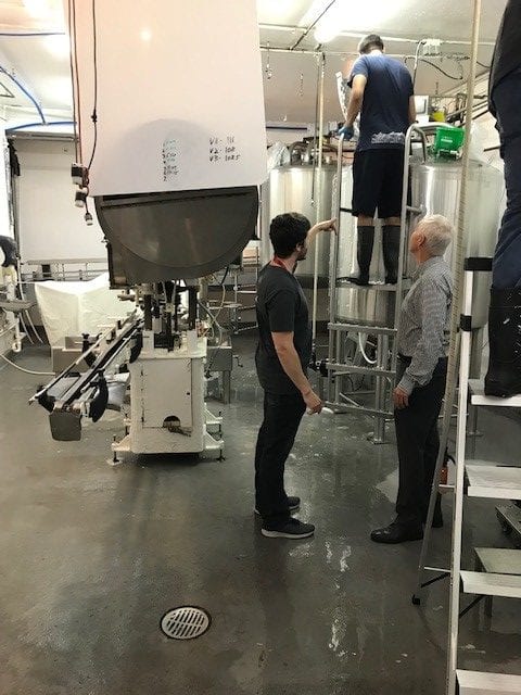 Jerry Llewellyn observing a client production line to map workflow and process bottlenecks